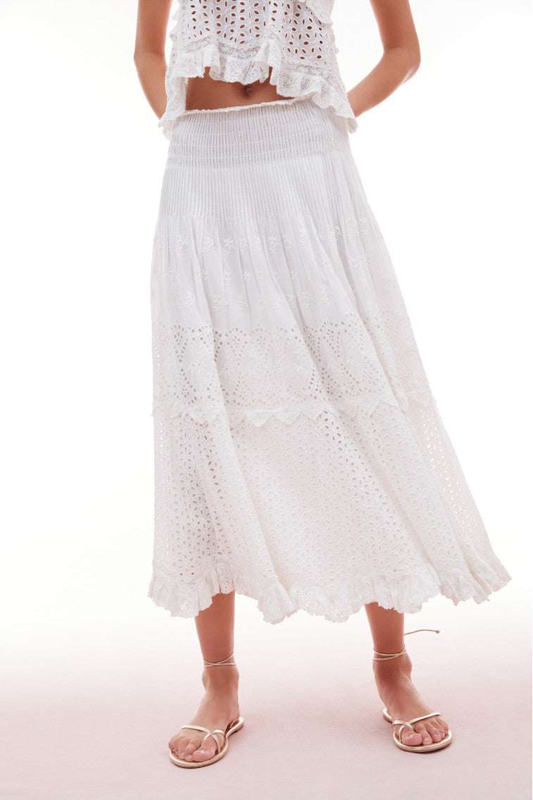 Midi skirt with eyelet details all over and tossed floral embroideries for texture and delicate pintucks.