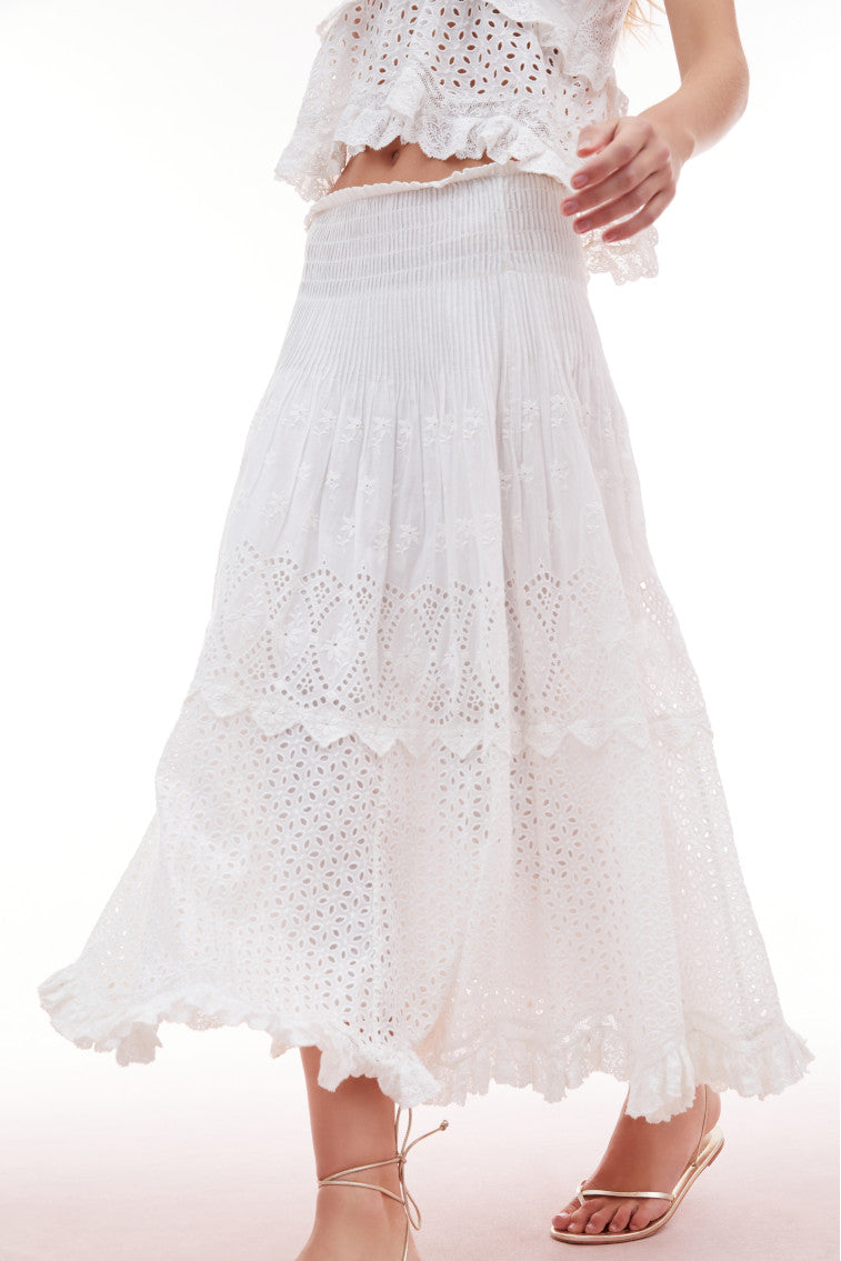 Midi skirt with eyelet details all over and tossed floral embroideries for texture and delicate pintucks. 