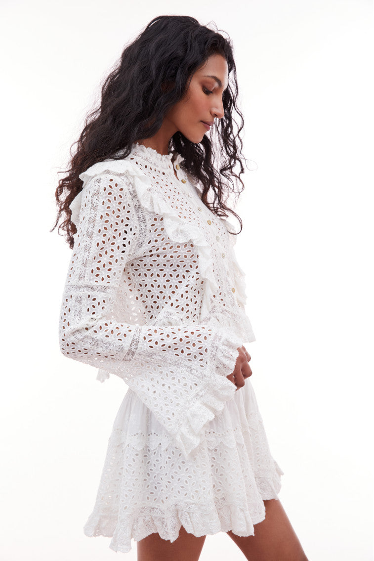 Long belle sleeve top with eyelet detail all over and zig zag ruffles lining the lace princess seams.
