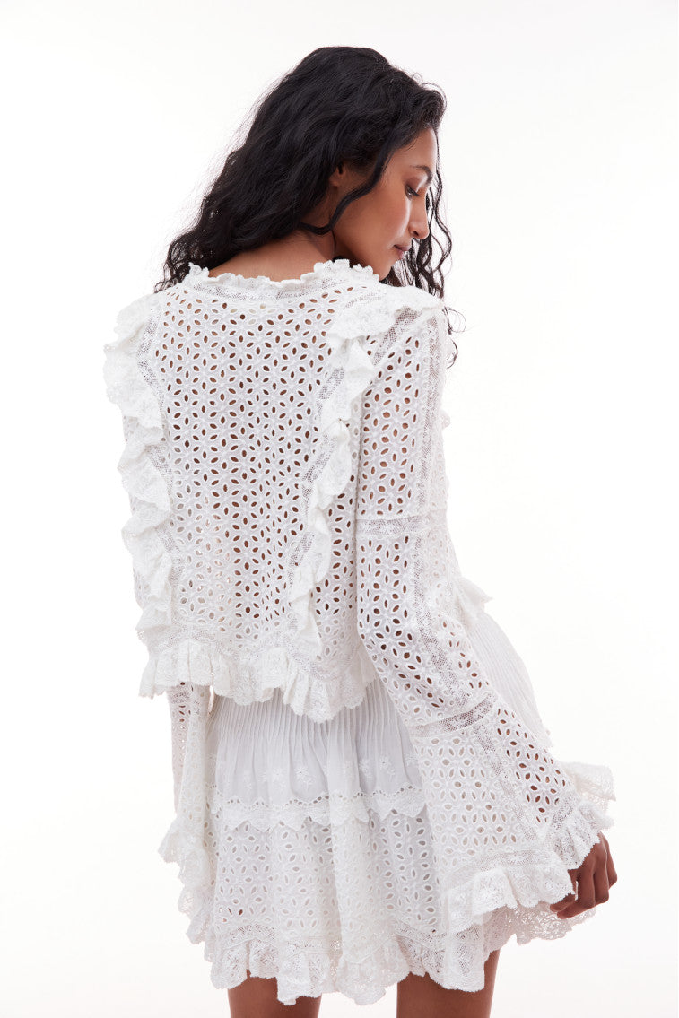 Long belle sleeve top with eyelet detail all over and zig zag ruffles lining the lace princess seams.