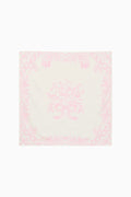 Pink and white patterned square scarf on a white background