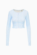 Light blue long-sleeve top on a white background