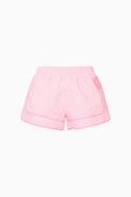 Pink checkered shorts on a white background