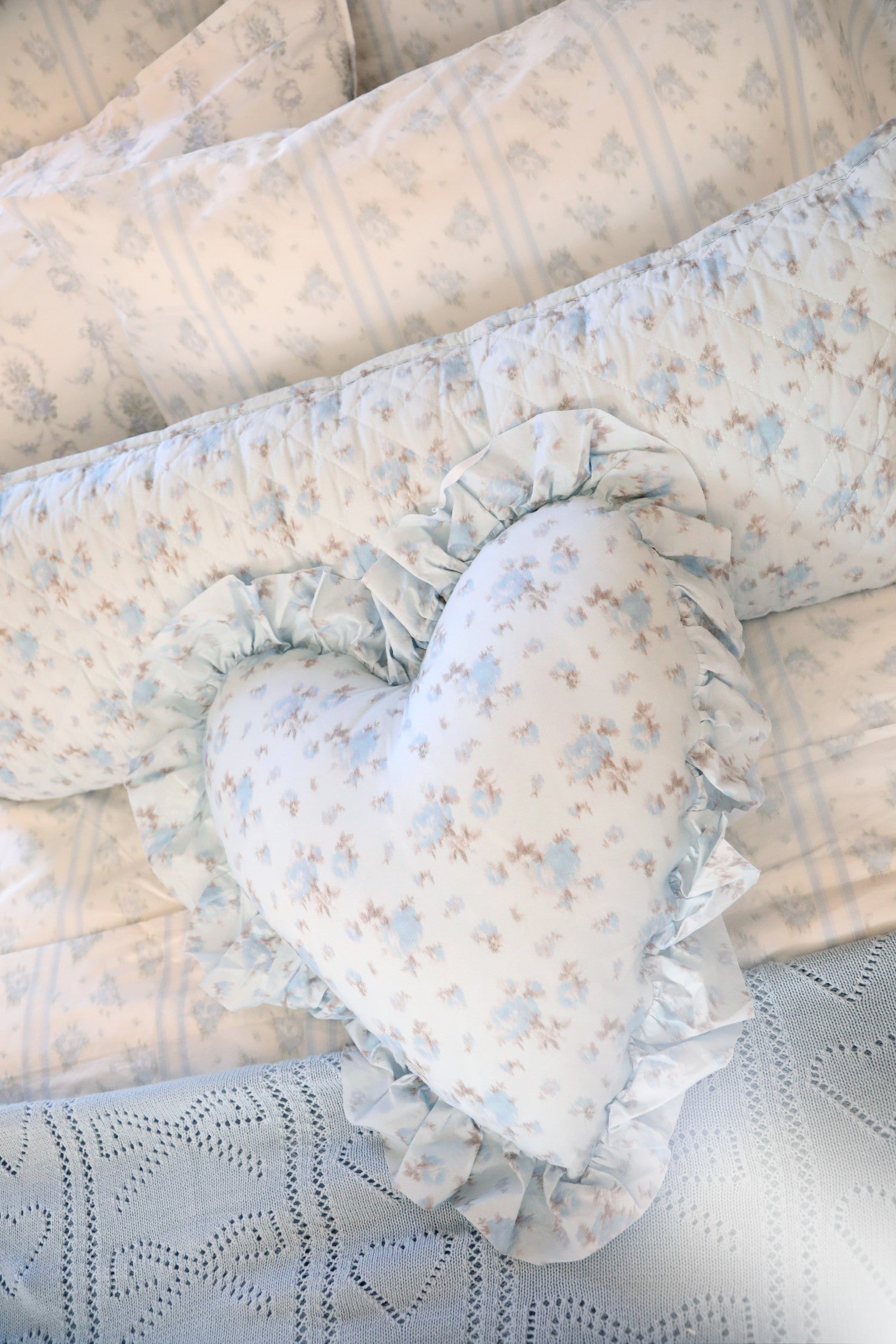 Blue, 100% cotton chic throw blanket. Featuring heart and bow-stripped pointelle details. 