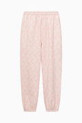 Pink pajama pants on a white background