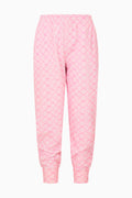 Pink bow print pants on a white background