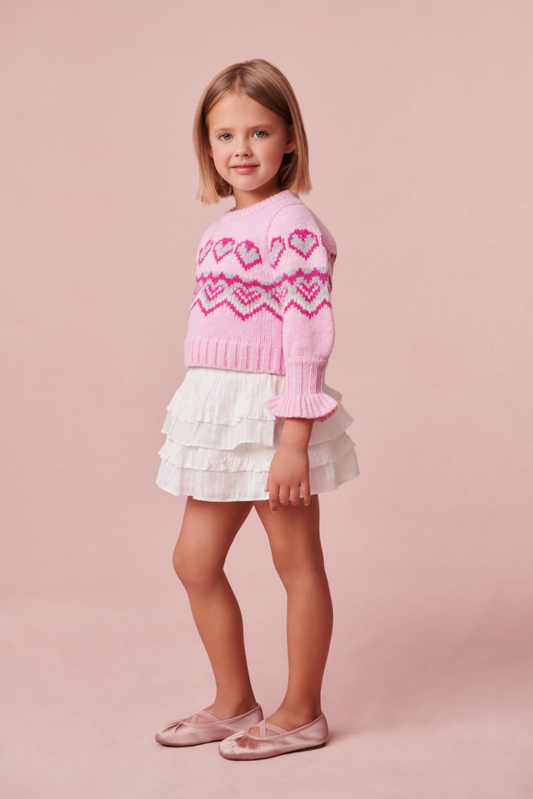 Ultra-soft plush pink knit stitched sweater with heart detailing.
