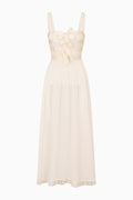 Beige dress with bow detail on a white background