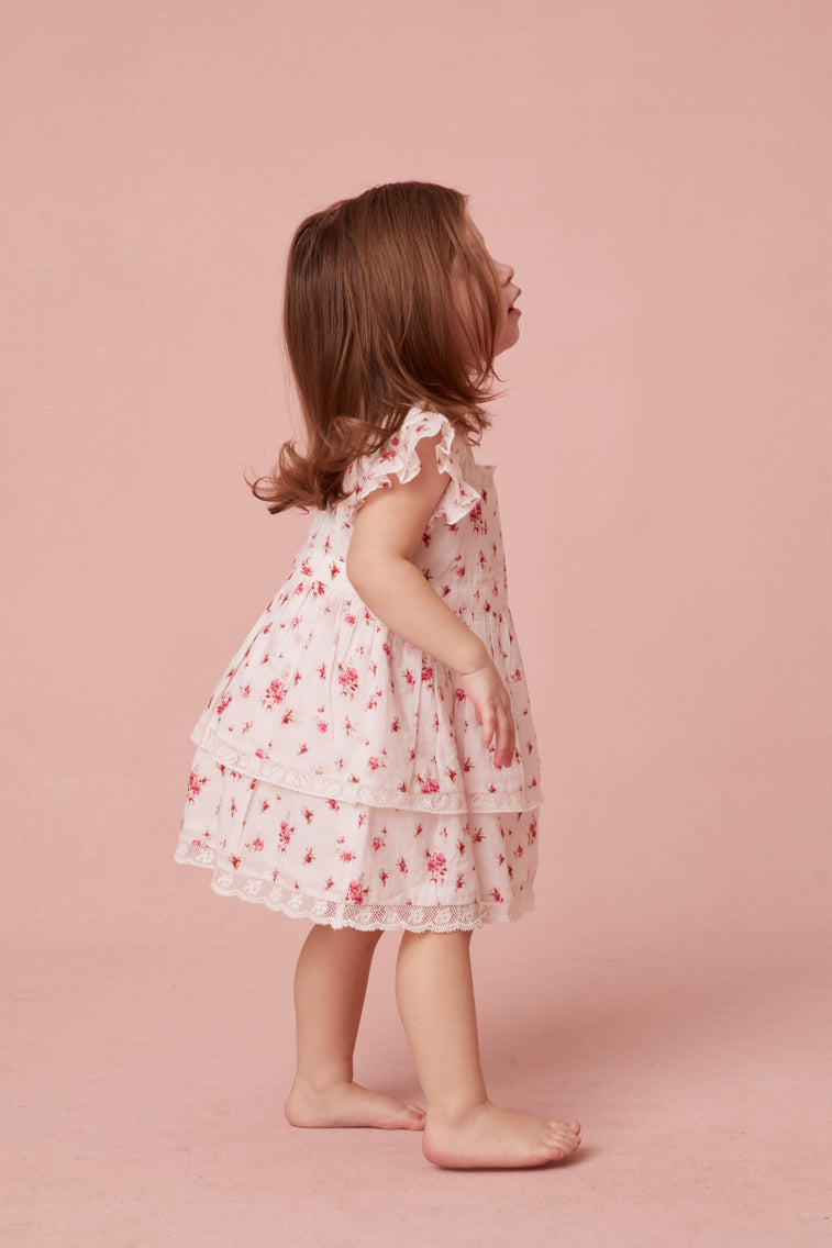 Dress with our ditsy floral print, short flutter sleeves, a square neckline, and an airy skirt.