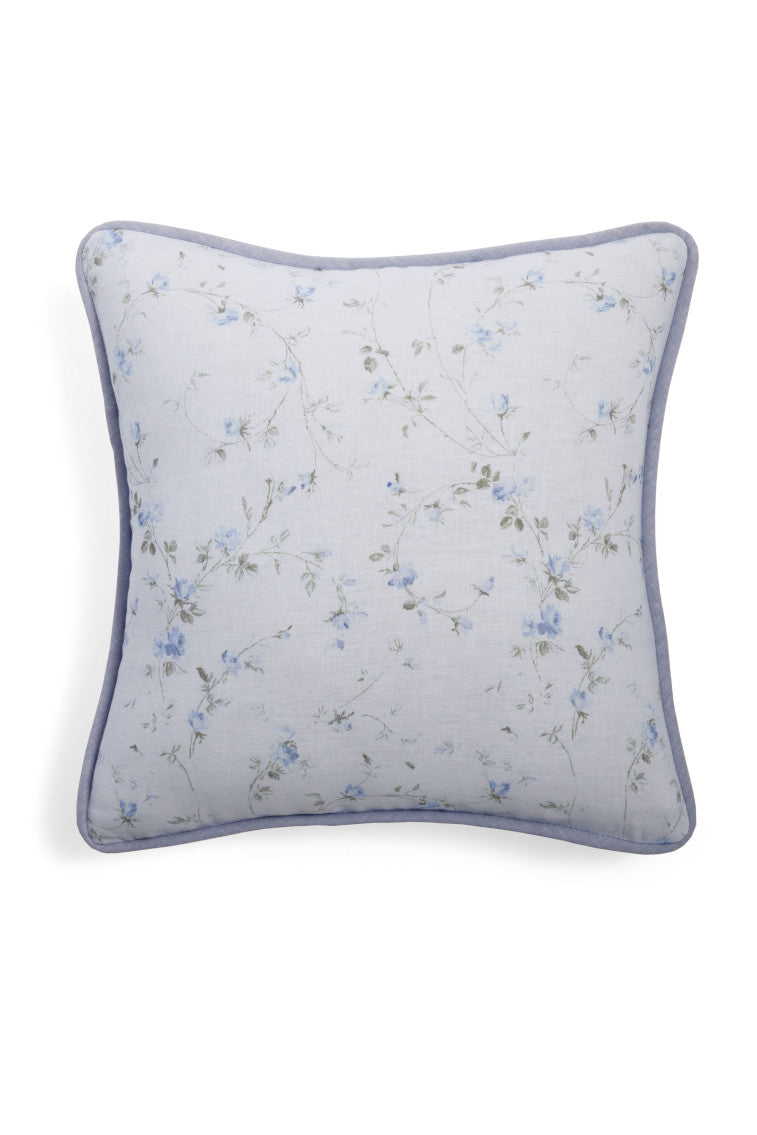 Blue throw pillow with a floral print.