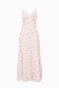 White dress with pink floral pattern on a white background