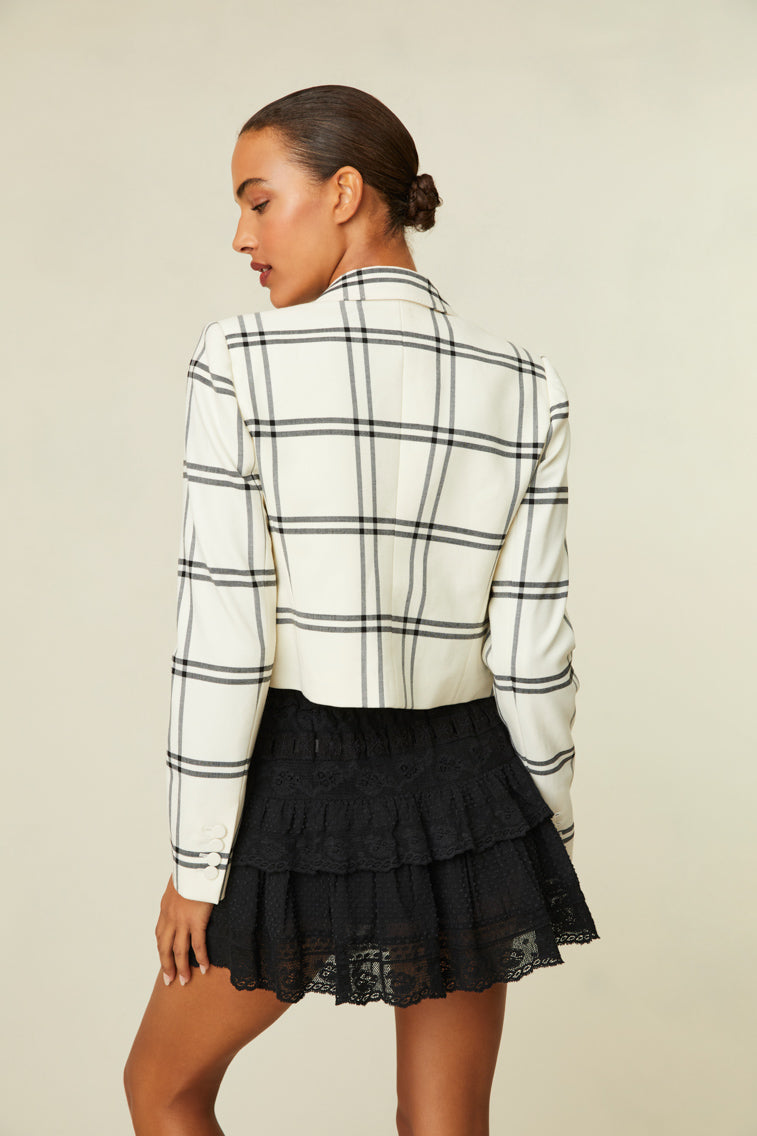 Fitted jacket featuring a chic black and white plaid.