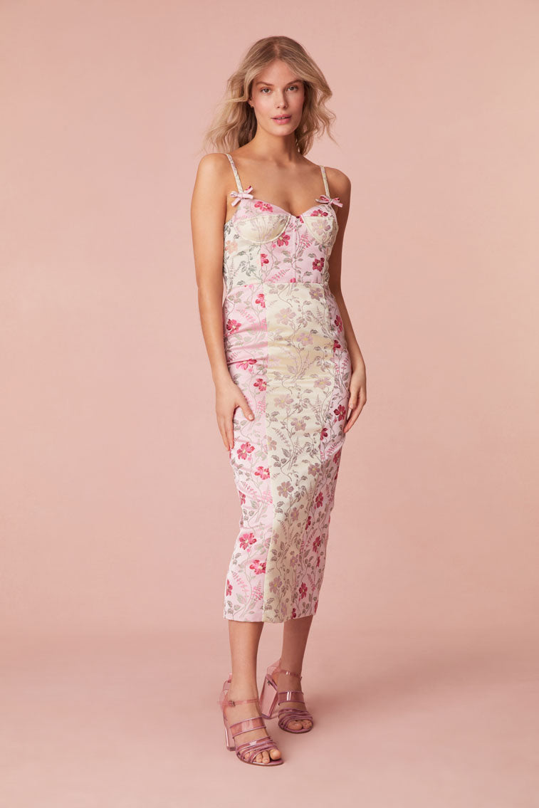 Bustier pencil dress with two types of color-blocking prints features cup details at the bust and princess seams down the front.