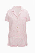 Pink patterned pajama set on a white background