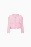 Pink cardigan with scalloped edges on a white background