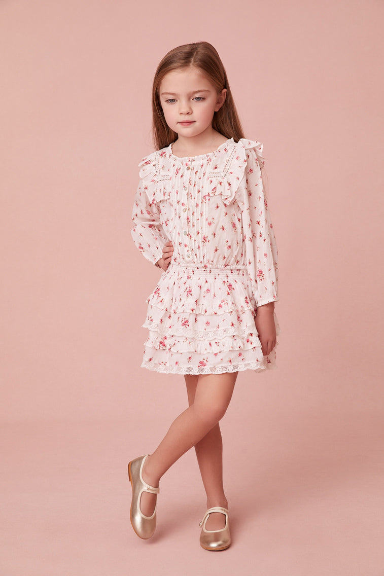 Floral print blouse featuring intricate custom lace detail at the round neckline and throughout the ruffle-adorned bib, airy long sleeves and small embroidery detail all over.