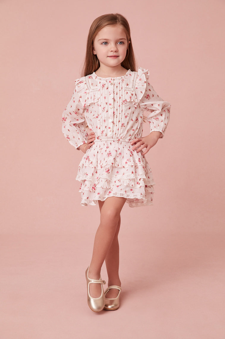 Floral print blouse featuring intricate custom lace detail at the round neckline and throughout the ruffle-adorned bib, airy long sleeves and small embroidery detail all over.