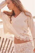 Ivory wool sweater with lace trim and floral lace appliqué