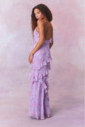 Purple floral chiffon maxi dress with spaghetti straps and ruffles that descend into the maxi skirt.