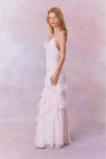 White floral chiffon maxi dress with spaghetti straps and ruffles that descend into the maxi skirt.