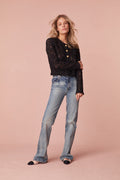 Jacket with floral lace with texture for elevated detail. The jacket features sheering, custom gold military buttons, and chic satin trim details.