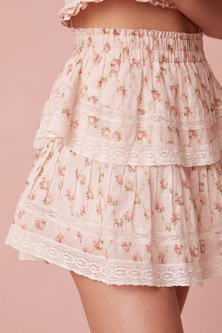 dainty floral print ruffle tiered skirt with elastic waistband and a frayed, raw hem for added playfulness.