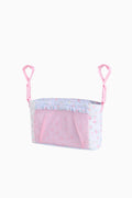 Pink and white stroller carrier with ruffled trim on a white background