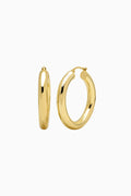 Gold hoop earrings on a white background
