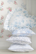 Ruffled linen throw pillow, light blue floral print with gathered edge detail