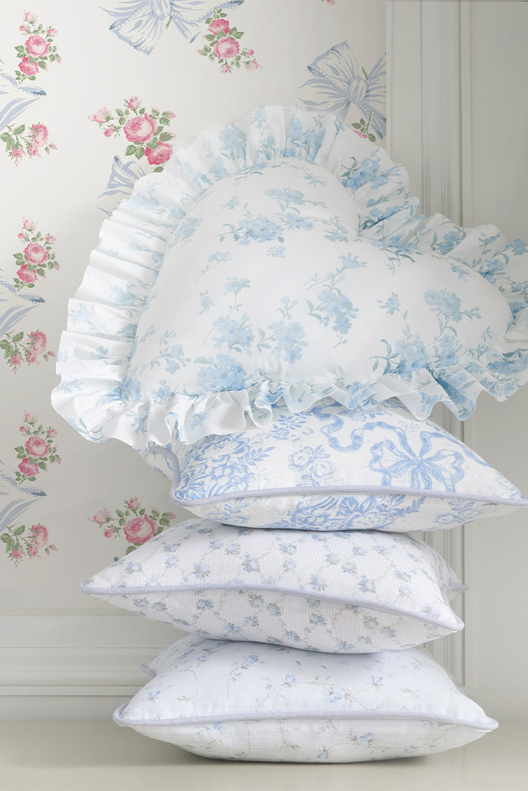 Ruffled linen throw pillow, light blue floral print with gathered edge detail