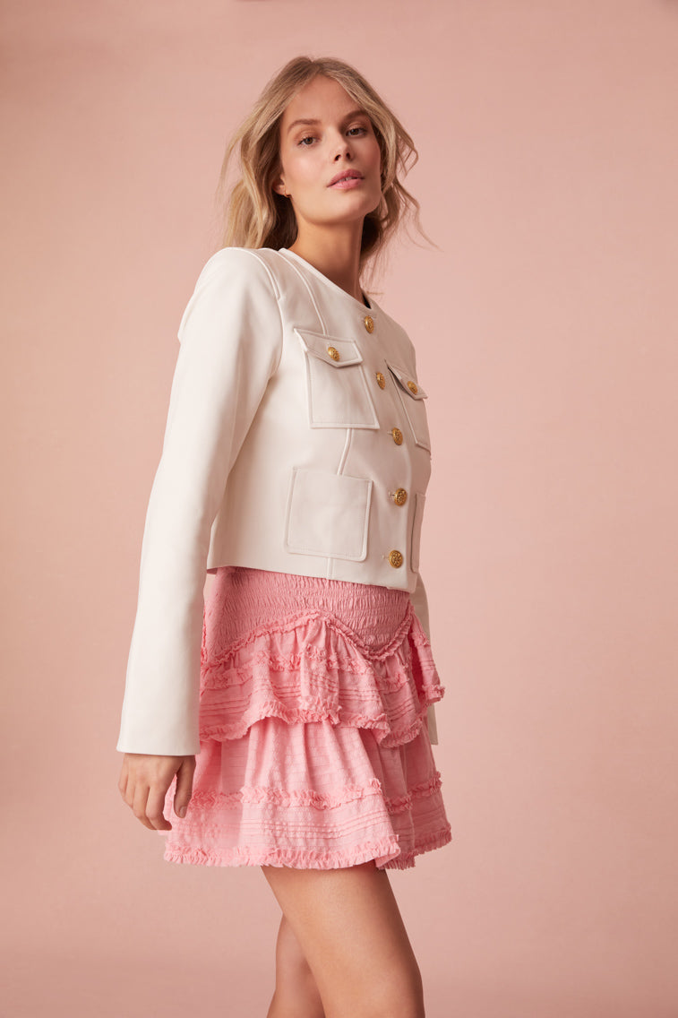 Mini skirt with stripe texture, top-applied ruffle details in a zigzag formation, and a smocked waistband.