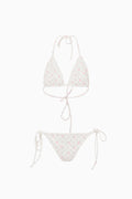 White bikini set with floral pattern on a white background