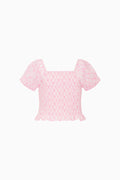 Pink blouse with bow pattern on a white background
