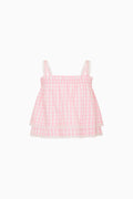Pink gingham top on a white background