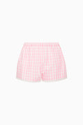 Pink gingham shorts on a white background