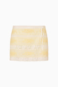 Yellow and white lace striped mini skirt with lace trim on a white background