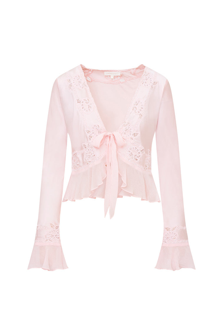 Long bell sleeve top with sheer embroidery and intricate thread work with tiny rhinestones for added shimmer. This blouse features ruffles at the peplum openings, a deep v-neckline with a tie detail at center front, and a peplum hem.