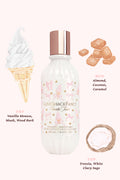 Love Shack Fancy vanilla mousse bottle with ice cream cone, coconut pieces, and flavor notes on a white background
