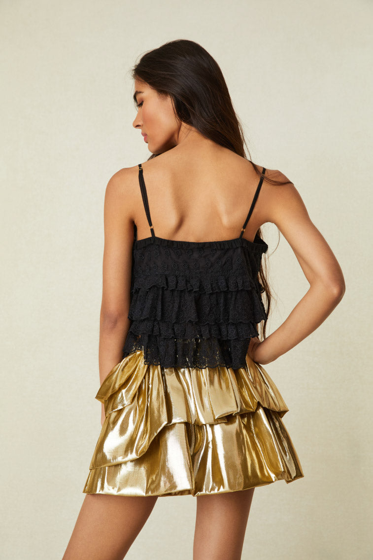 he skirt begins with an elastic waistband with a black removable velvet tape belt before falling to asymmetric ruffles and a playful bubble hem.