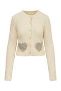 Cream wool-blend cardigan with button front and heart-shaped sequin pockets
