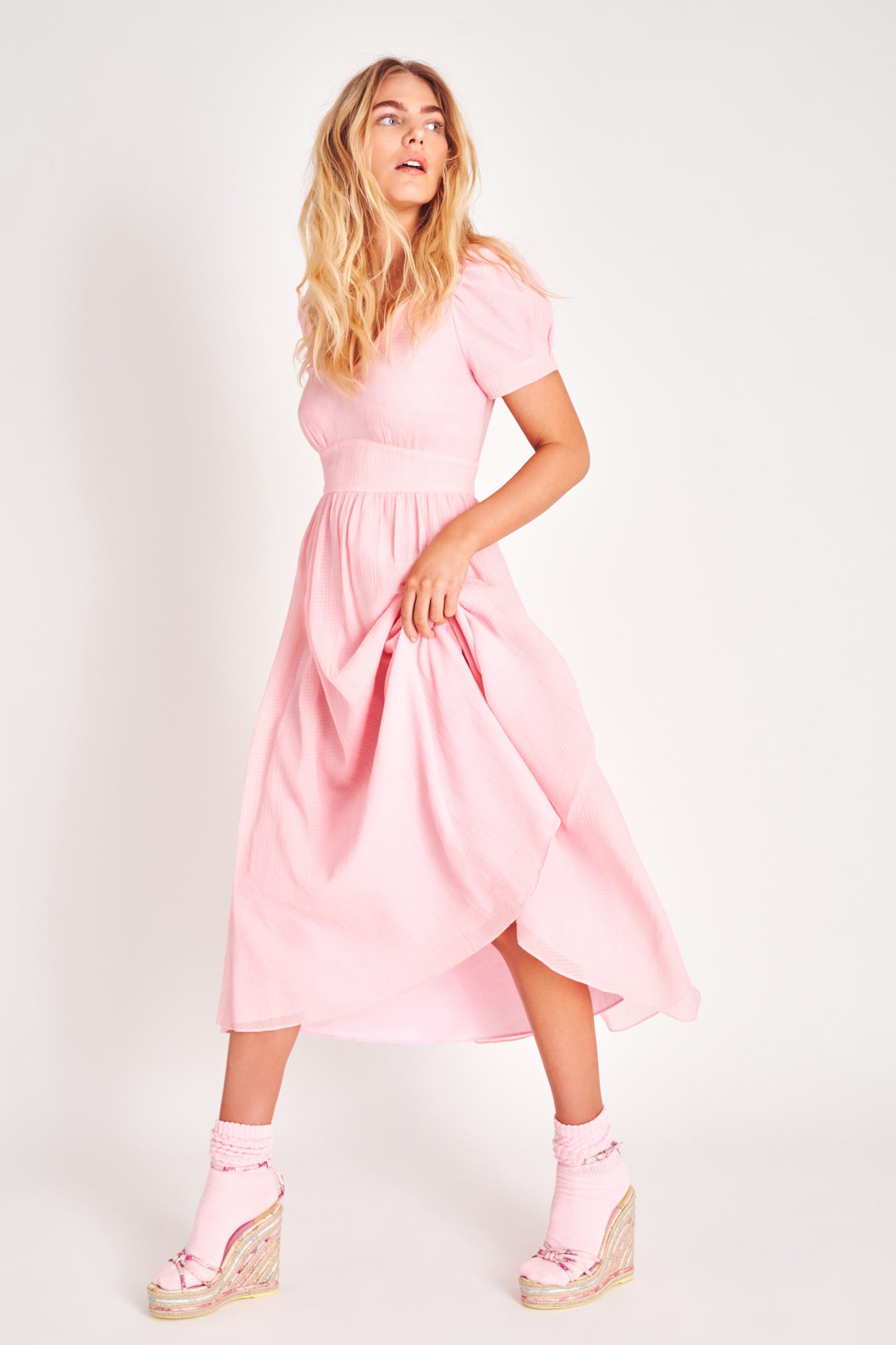 Powder Pink puff sleeve v neck midi dress with fitted waist.