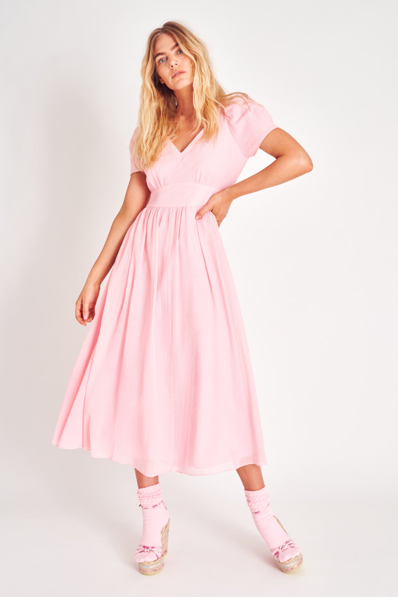 Powder Pink puff sleeve v neck midi dress with fitted waist.