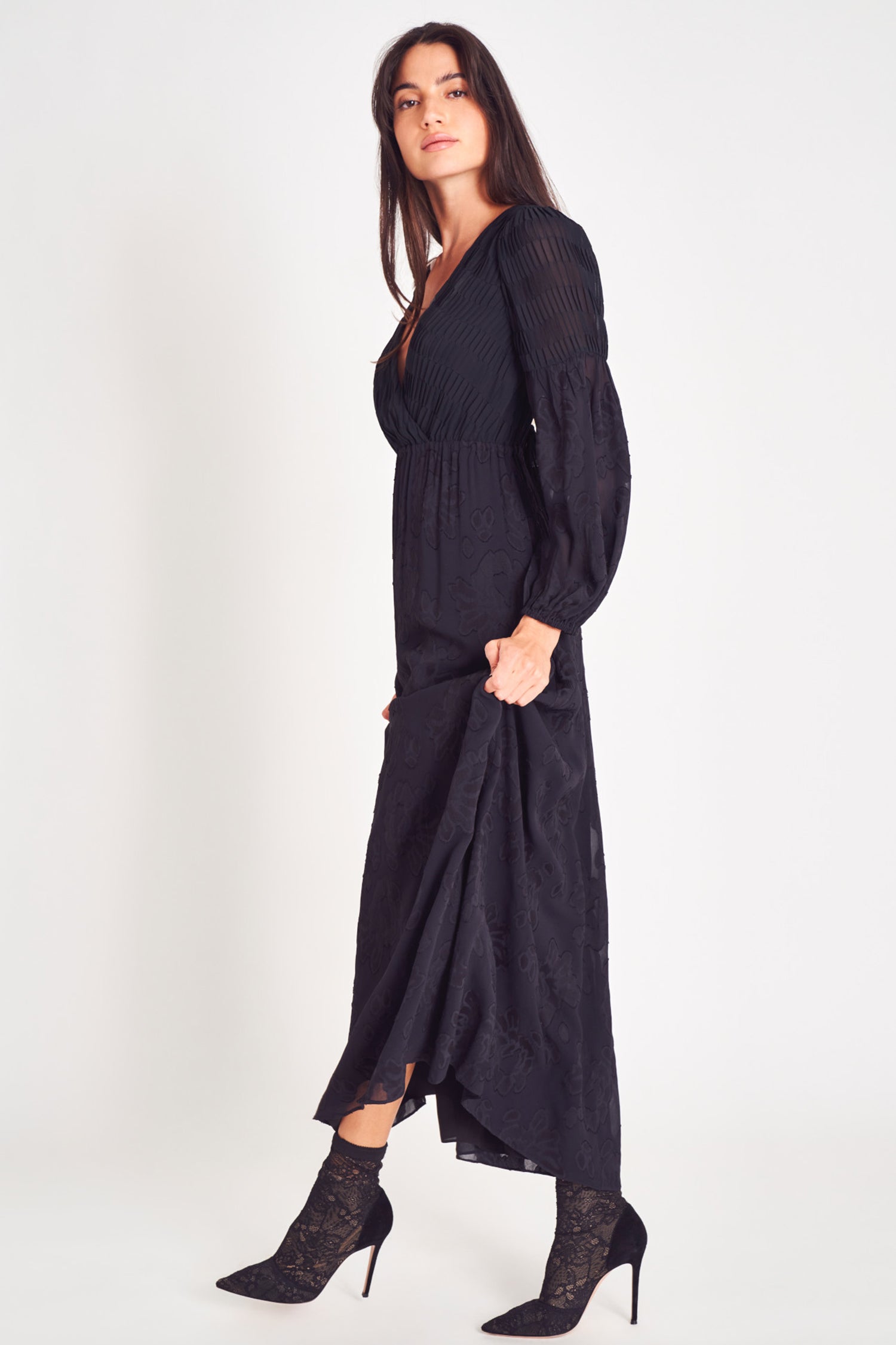 Black v neck long sleeve maxi dress with floral jacquard and pleated texture fabric. 