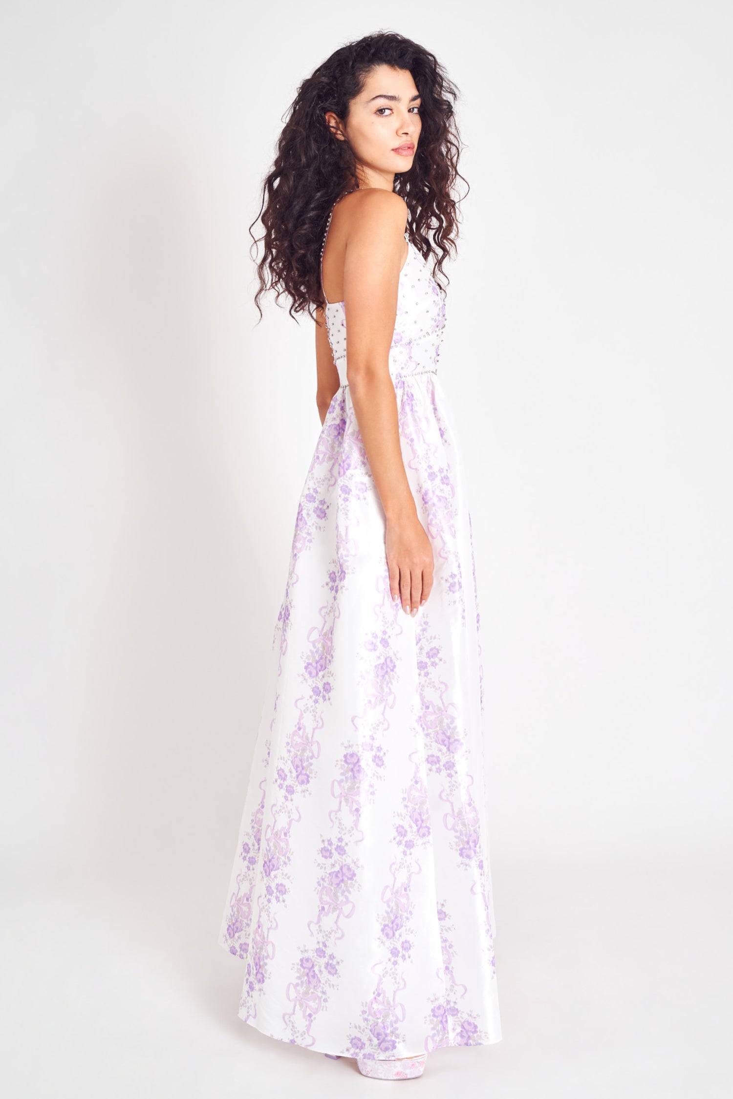 Lilac floral maxi dress with fitted waist and spaghetti straps.