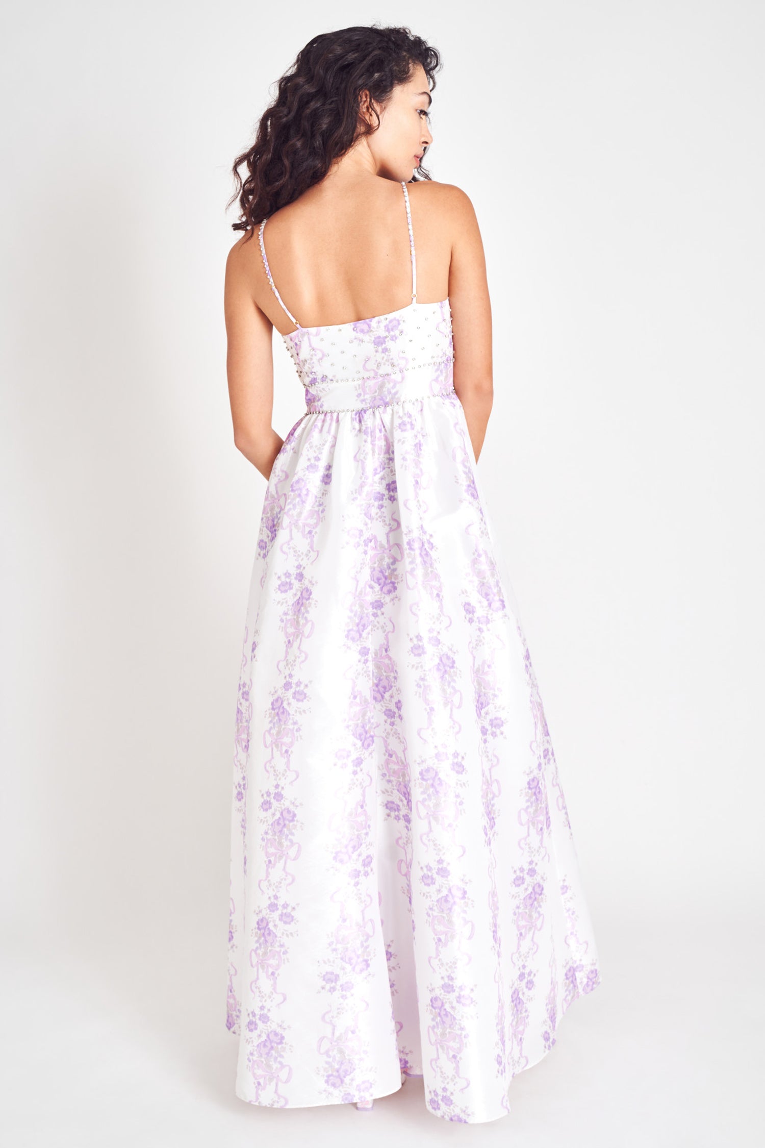 Lilac floral maxi dress with fitted waist and spaghetti straps.