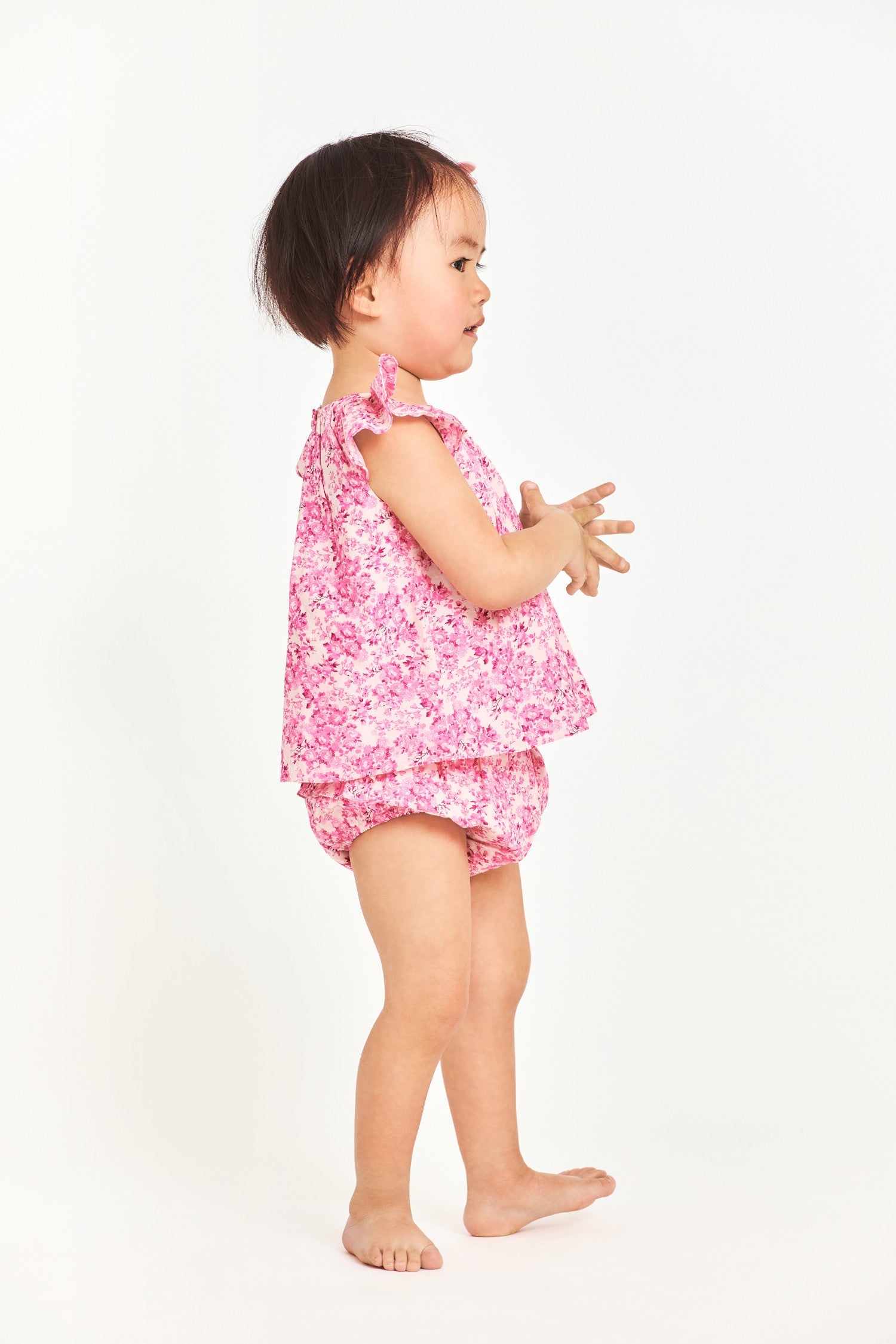 Pink floral baby top with ruffle sleeves