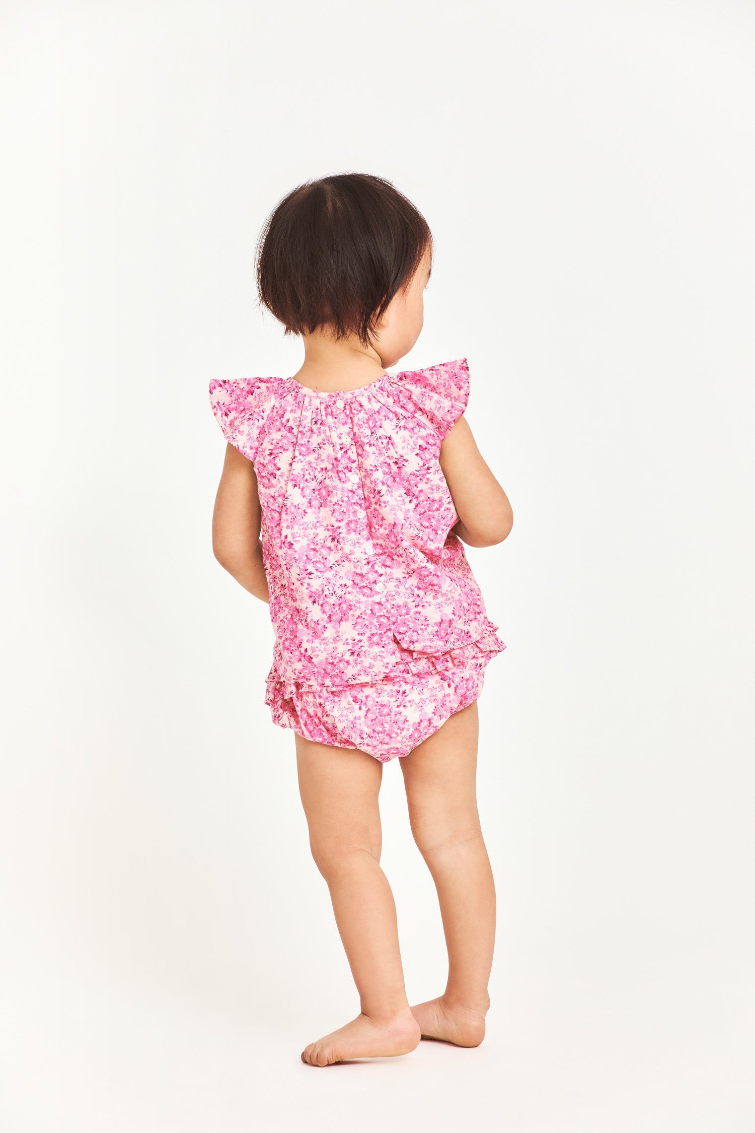 Pink floral baby top with ruffle sleeves