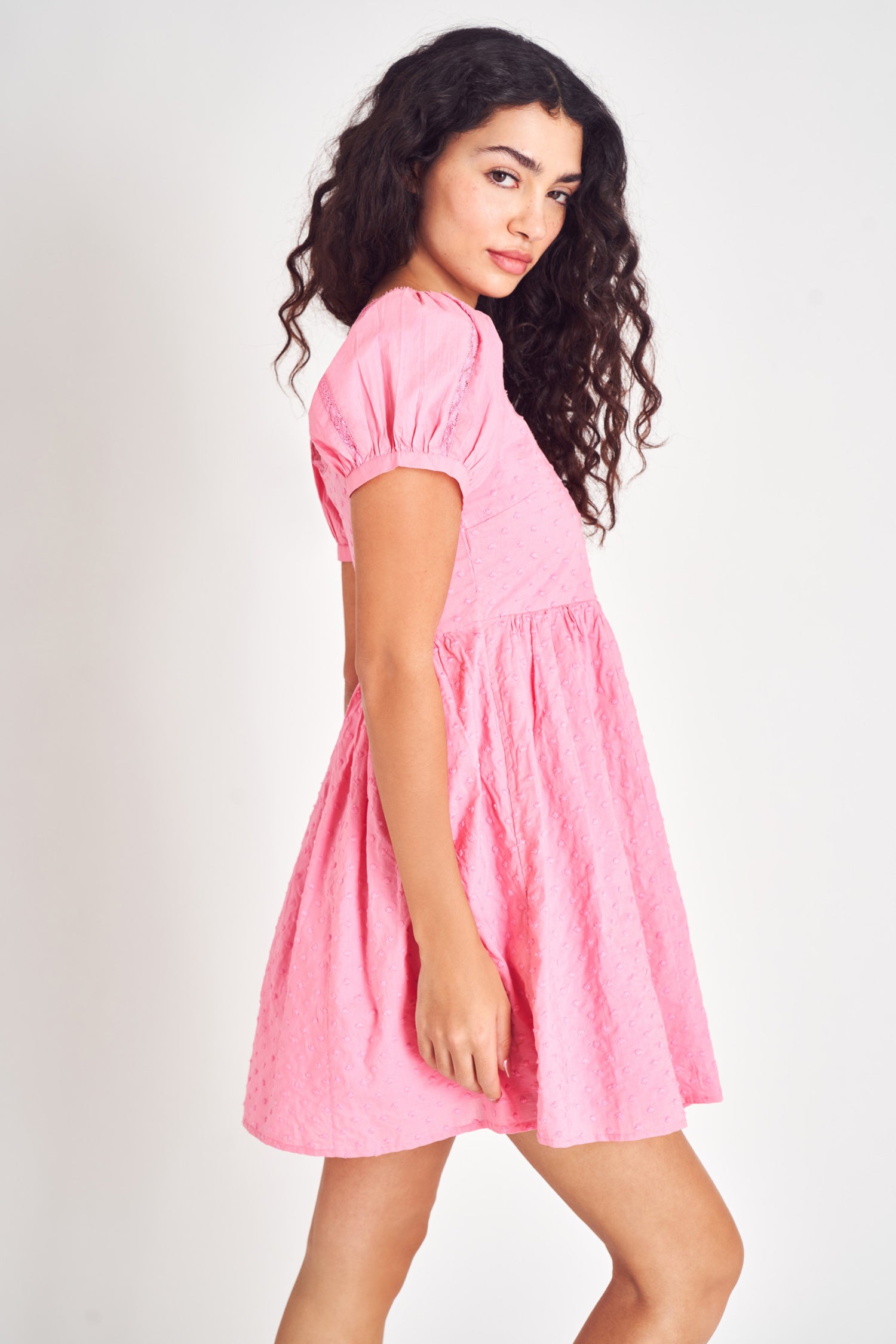 Pink embroidered puff sleeve mini dress.