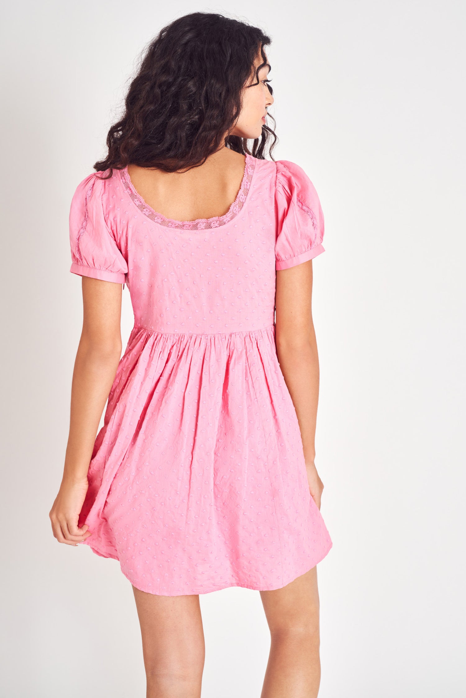Pink embroidered puff sleeve mini dress.