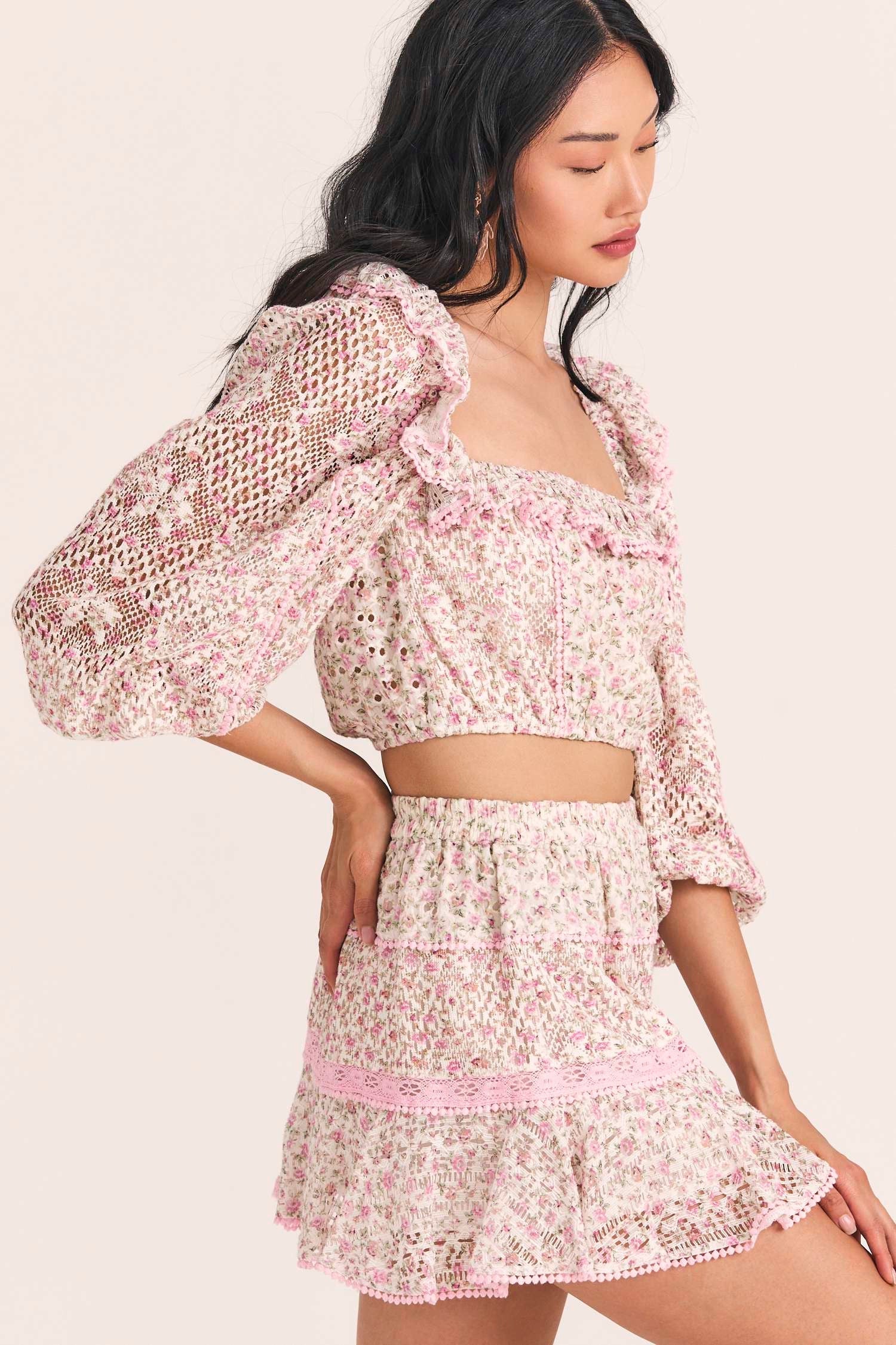 Women's three quarter sleeve cropped top with custom lace and eyelet fabrication, in a mixed micro floral print. 